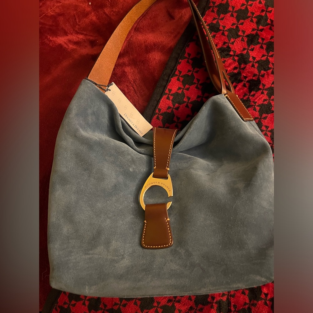 Dooney shoulder bag blue suede with tan leather straps.